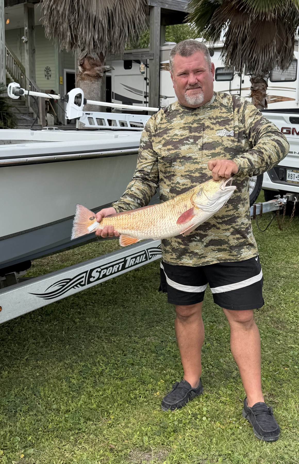 Captain Scott Wanner holding a redfish